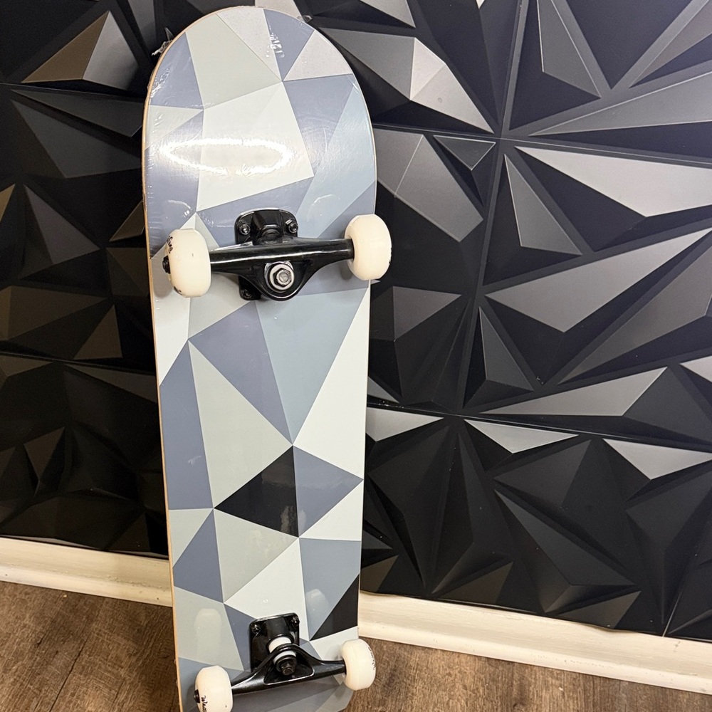 Geometric Pattern Skateboard With White Wheels - image 1
